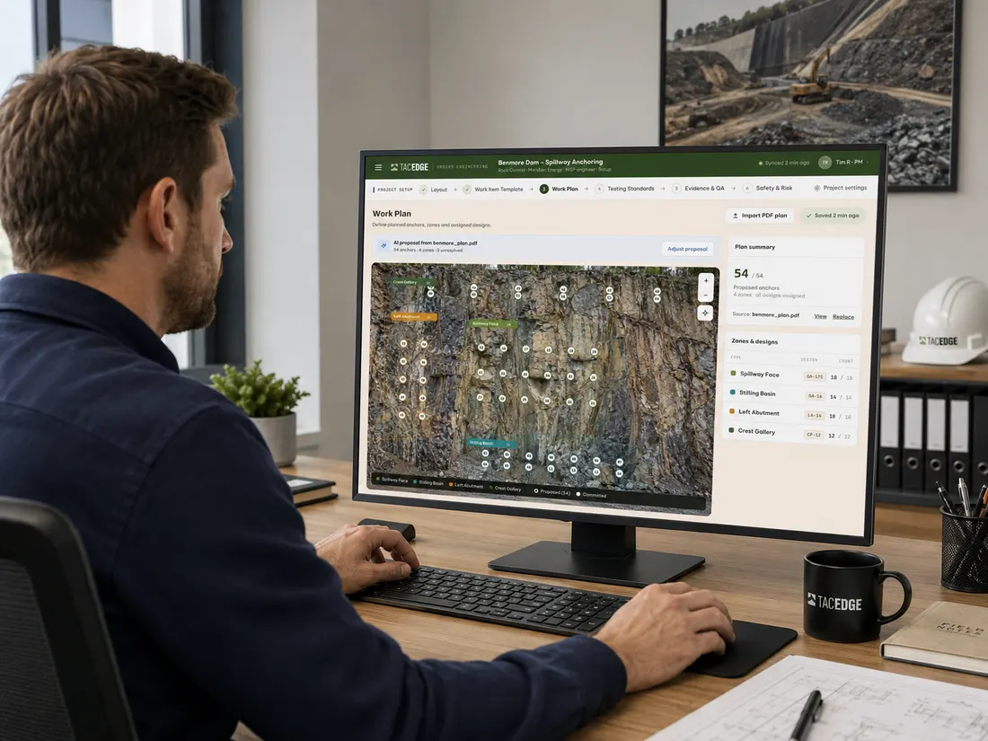 Project manager at a desktop in the office, setting up a work plan of anchors and zones over a site photograph in TACEDGE